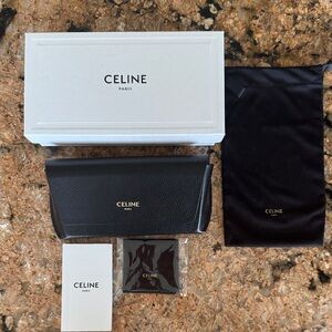 Celine Black Leather Clutch with Gold Accents
Sunglasses case